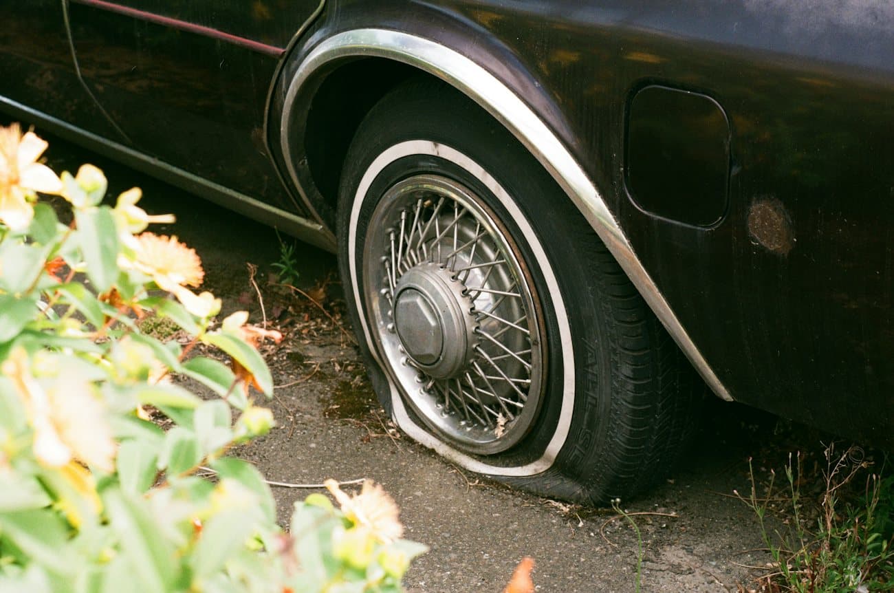 Completely flat tire on a parked car